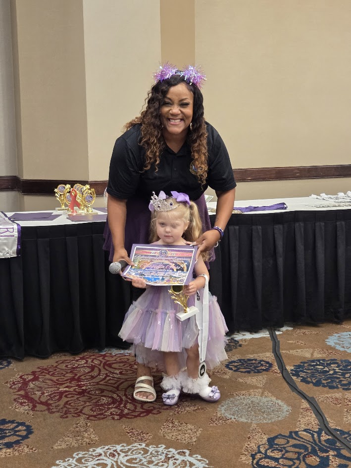Titleholder with certificate at Regionals
