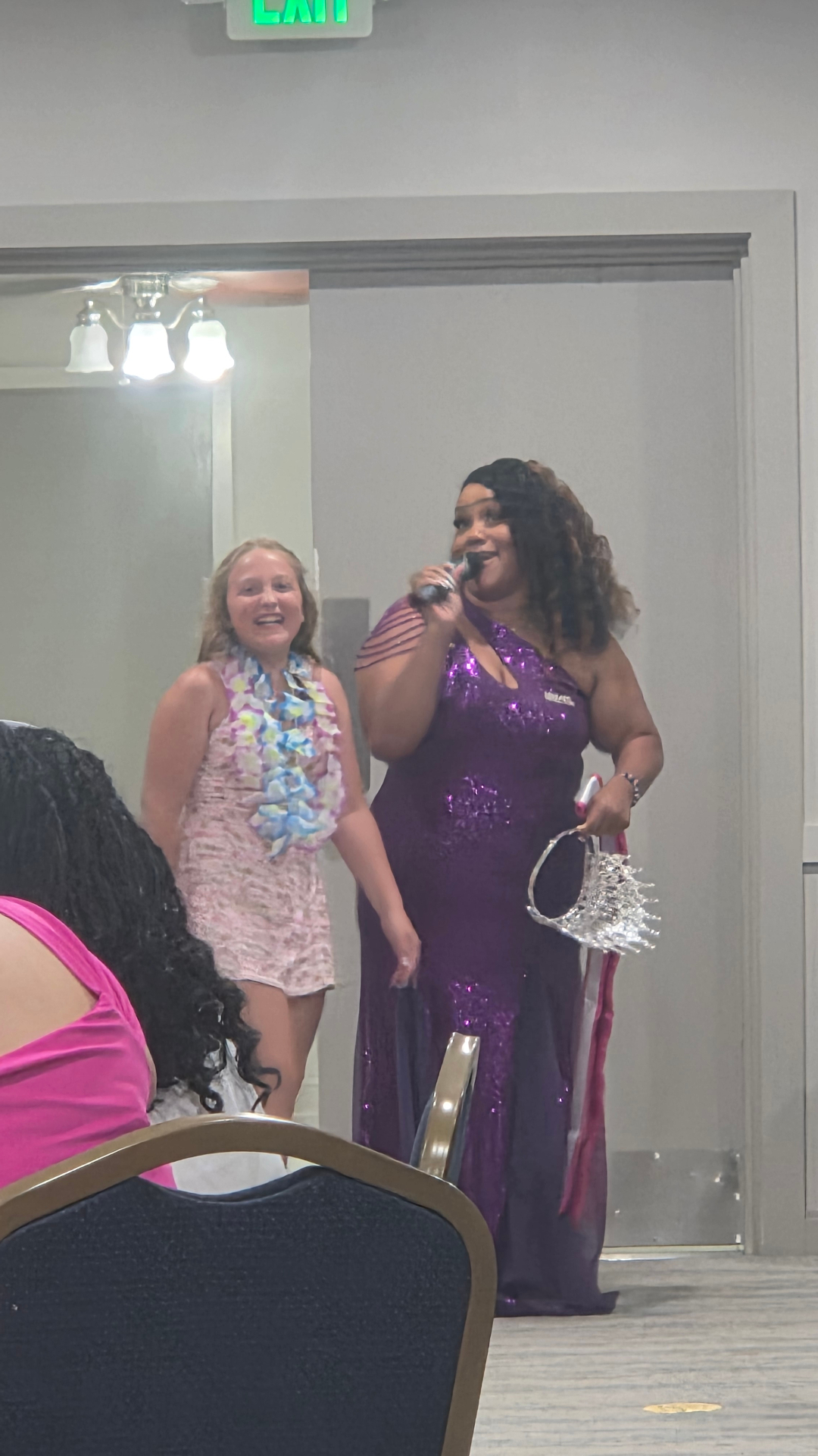 Titleholder receiving crown on stage at Nationals 2026