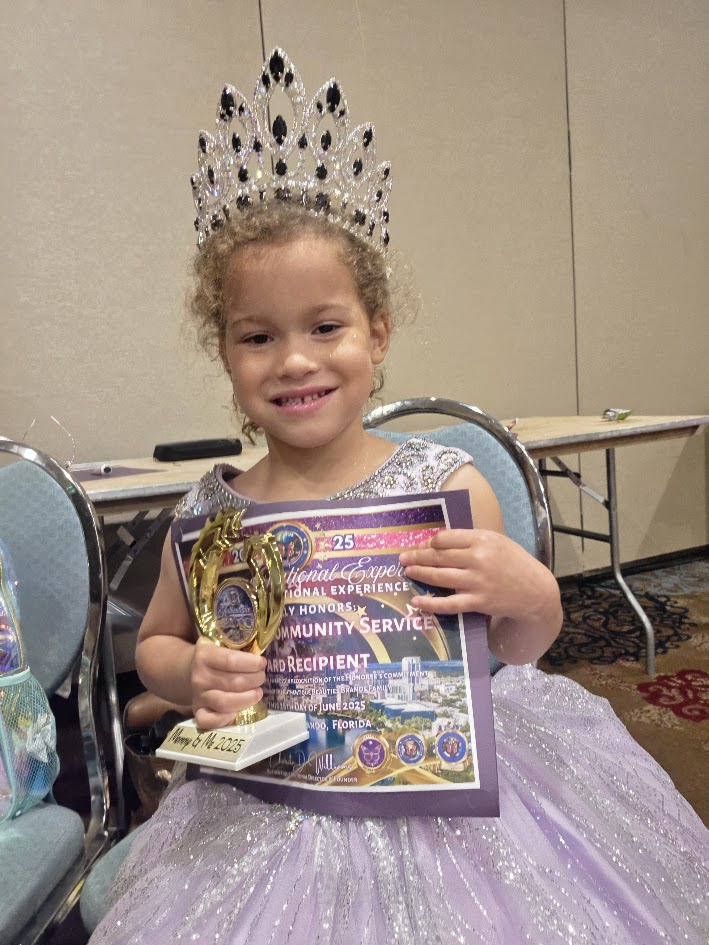 Lochlyn Rode with Community Service Award trophy